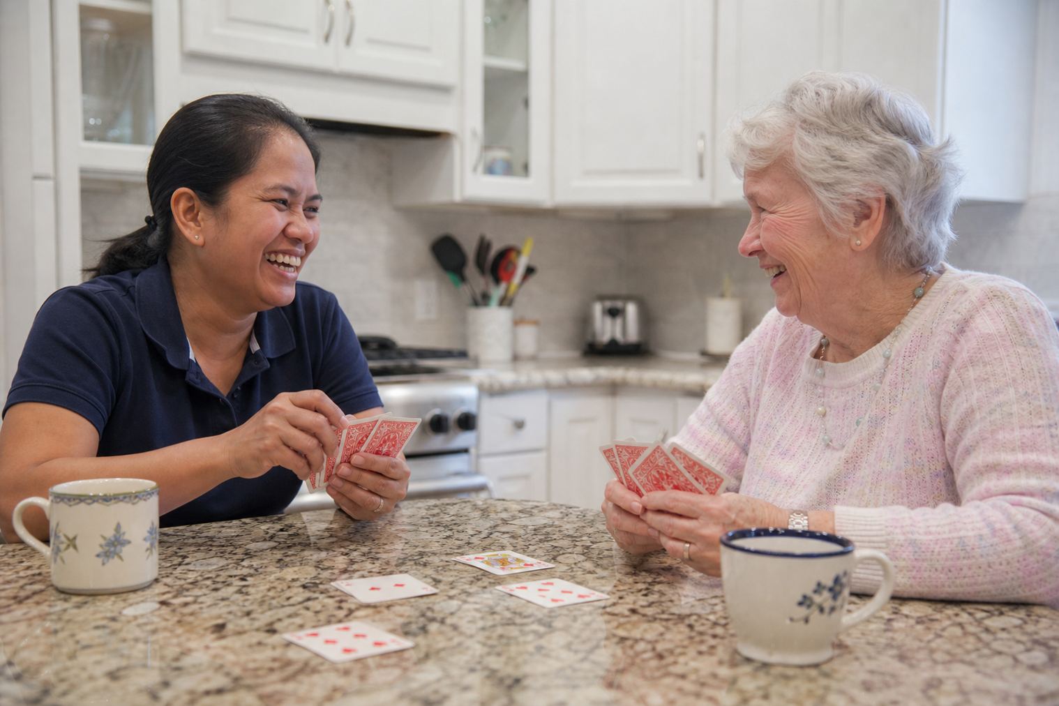 A caregiver playing cards with an older adult in a Bolingbrook kitchen